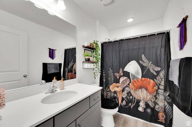 Full bathroom featuring toilet, vanity, and wood finished floors | Image 18