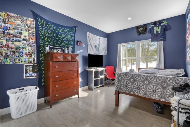 Bedroom featuring light hardwood / wood-style floors | Image 19