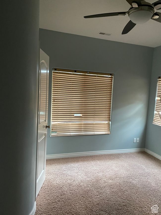 Unfurnished room with carpet and ceiling fan | Image 21