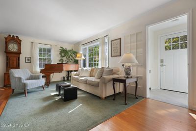 Living room & much of the house has hardwood floors. | Image 3