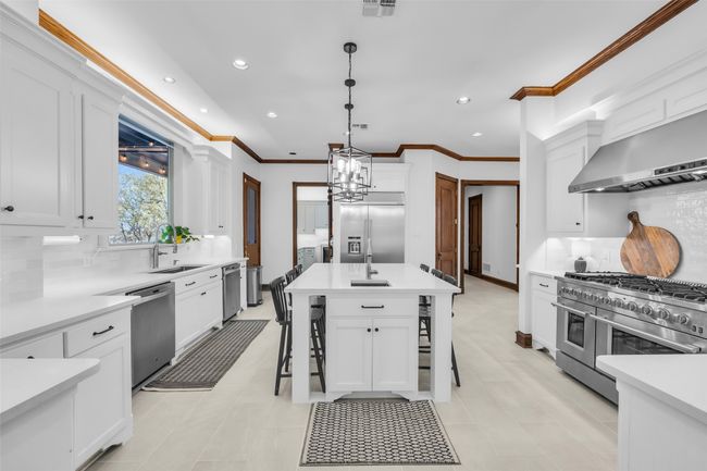 Updated kitchen is a chef's dream with 8 burner gas stove and double ovens PLUS 2 dishwashers! | Image 12