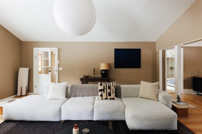 Living room featuring lofted ceiling and wood-type flooring | Image 6