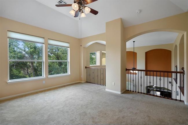Unfurnished room featuring ceiling fan, carpet flooring, and baseboards | Image 19