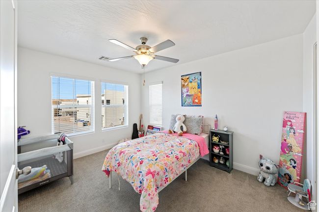 Bedroom featuring carpet flooring and ceiling fan | Image 23