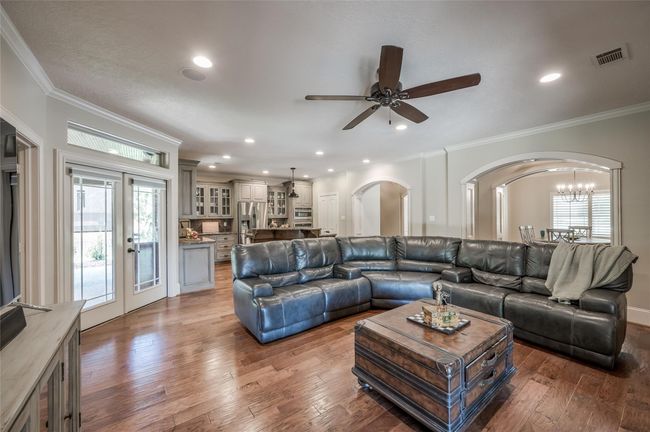 This open floor plan seamlessly blends well-defined spaces, offering both elegance and functionality. | Image 9