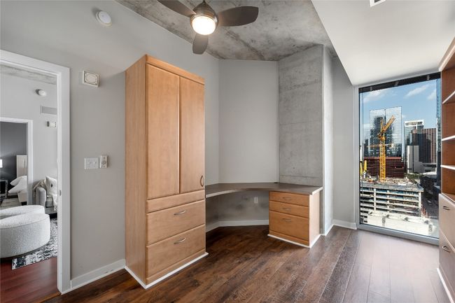 Home office featuring built in desk and murphy bed | Image 12
