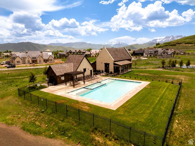 View of swimming pool featuring a mountain view and a residential view | Image 62