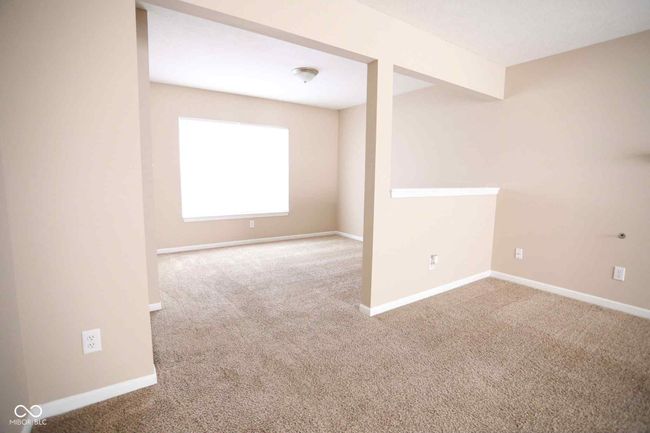 unfurnished room with carpet floors and baseboards | Image 8