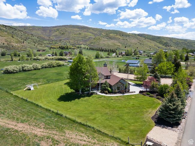 View of rural area with a mountain backdrop and agricultural land | Image 73