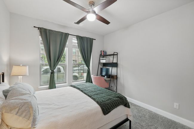 Carpeted bedroom featuring baseboards and a ceiling fan | Image 8