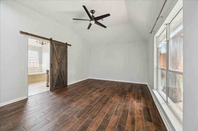 Barn door for the primary on-suite bath | Image 19