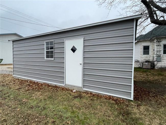 View of outdoor structure featuring a yard | Image 15