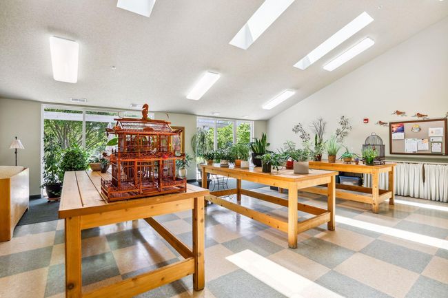 The Solarium is a bright welcoming space for your plants while you're away, featuring potting tables, sink and a separate faucet with unsoftened water. Glass doors open to a peaceful patio, providing the perfect spot to unwind. | Image 29