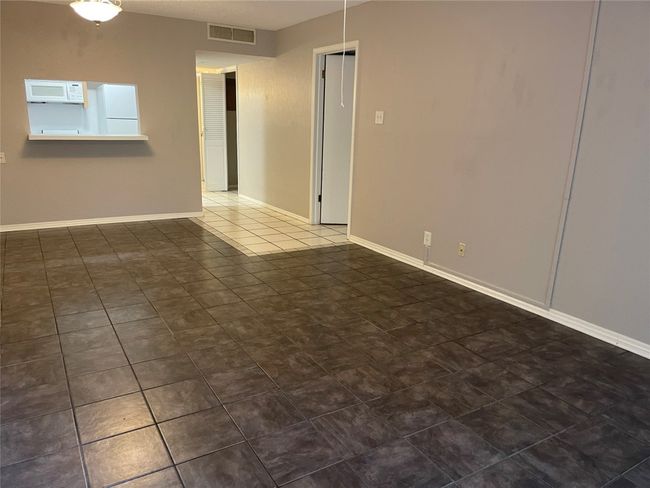 Tiled spare room with baseboards | Image 7