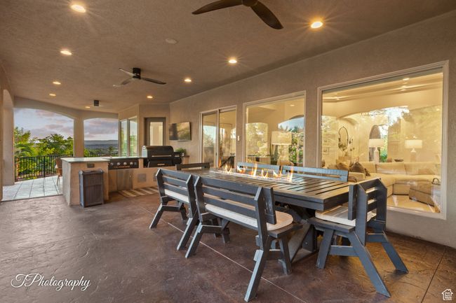 View of patio / terrace featuring ceiling fan and outdoor dining area | Image 51