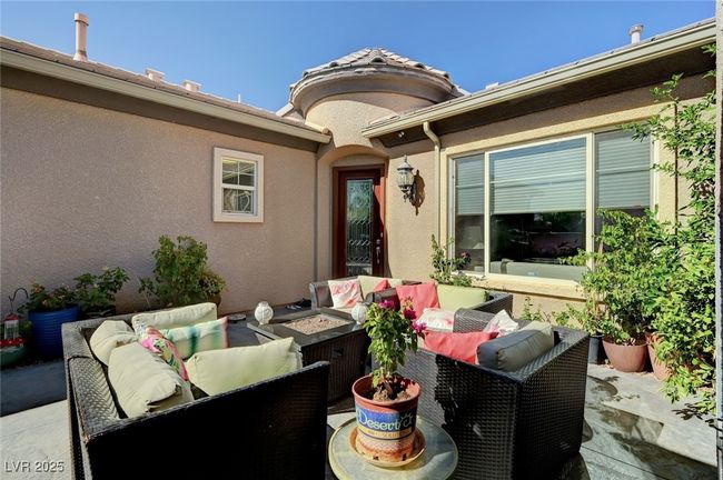 View of patio featuring an outdoor living space with a fire pit | Image 11