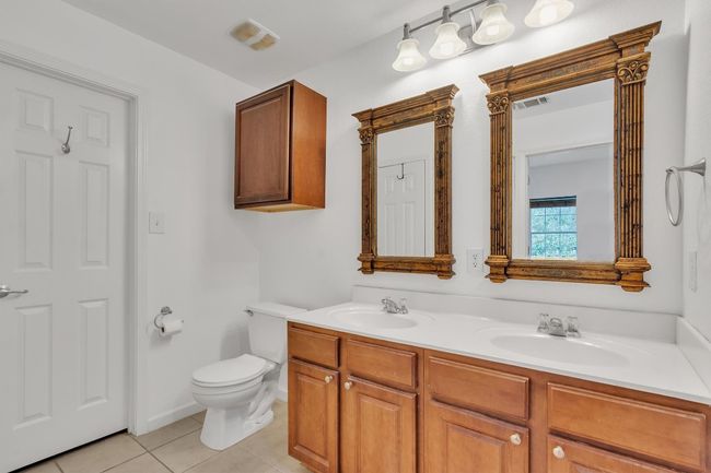 Primary bathroom with view of closet door | Image 21