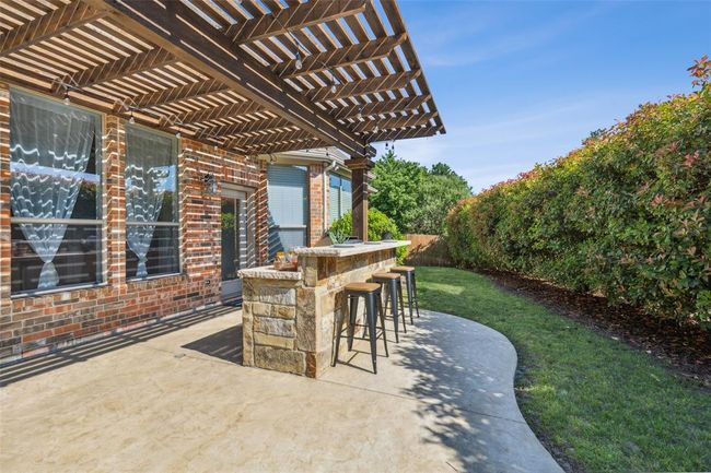 View of patio / terrace featuring a pergola and an outdoor bar | Image 30