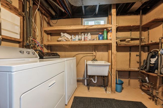 Laundry area featuring washing machine and dryer | Image 22