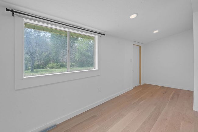 Spare room featuring light wood-style floors and recessed lighting | Image 17