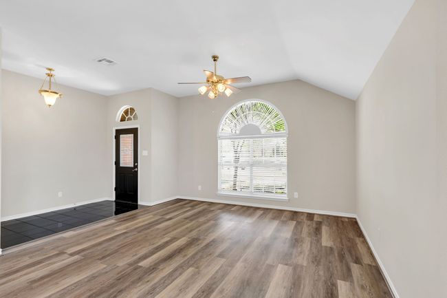 Black Marble Tiled Entry & Luxury Vinyl Flooring makes this Freshly painted room to place your stamp of approval! | Image 7