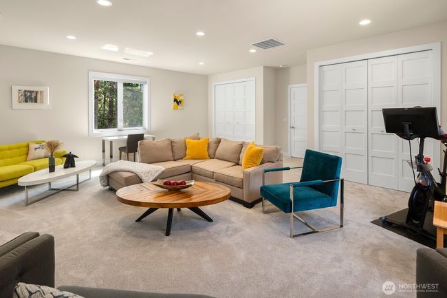 Another view of the bonus room, showing both large storage closets in the background. | Image 25