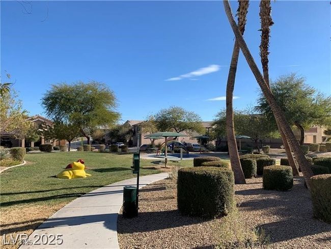 View of home's community with a lawn | Image 21