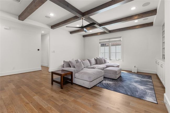 Wood beam accents, spacious & versatile game room | Image 28