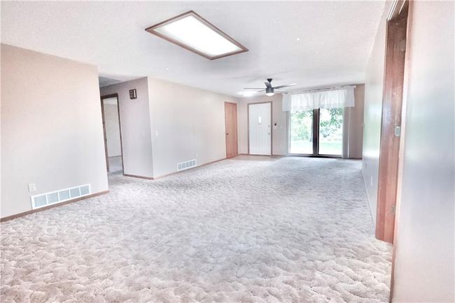Unfurnished room with carpet and ceiling fan | Image 22