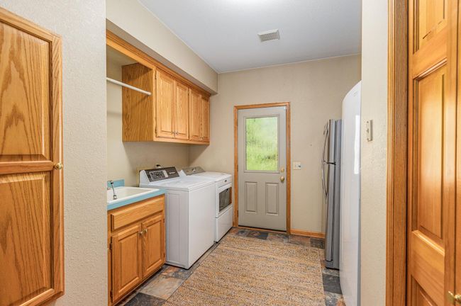 Large main floor laundry - 9316 Yukon Ave S | Image 37