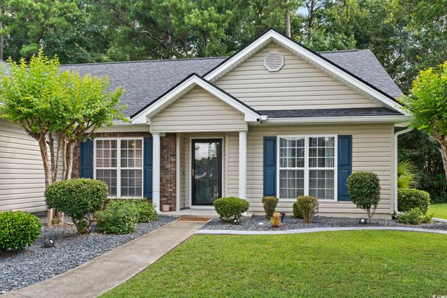 View of front of house with a shingled roof and a front lawn | Image 30