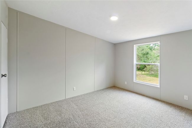 View of carpeted spare room | Image 9