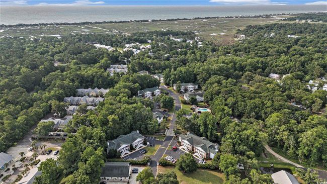 View of property location with nearby suburban area and a heavily wooded area | Image 30