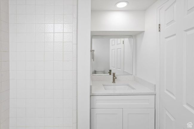 Bathroom featuring toilet and vanity | Image 34