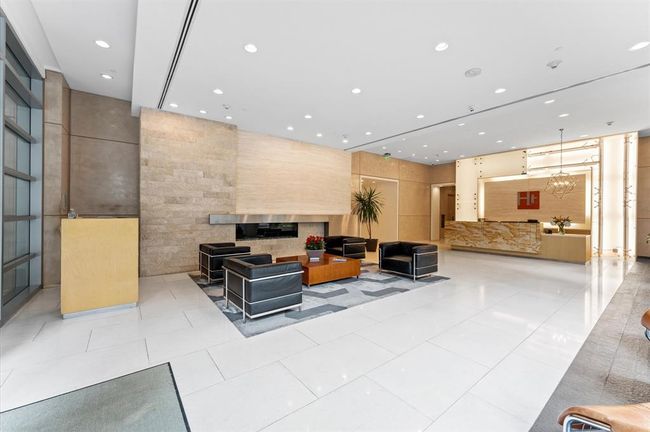 This photo showcases a sleek, modern lobby with minimalist design. | Image 23