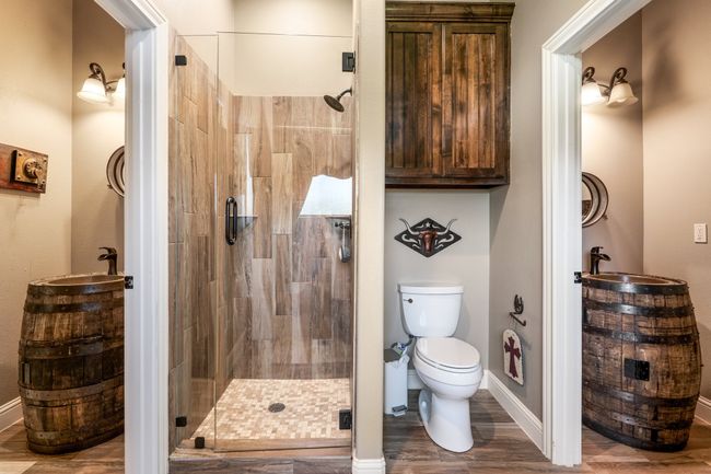 Bathroom featuring a shower stall and wood finished floors | Image 25