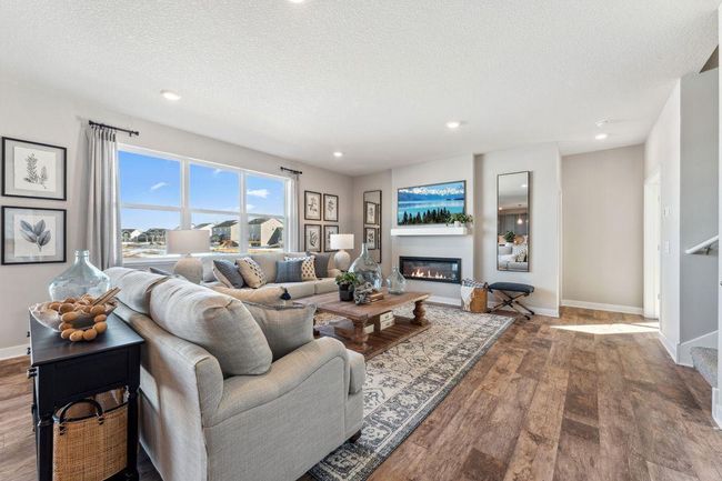 Imagine the view of mature trees through the living room windows. Photo of model home, colors and finishes will vary. | Image 14