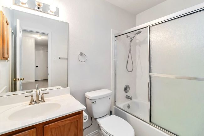 Full bath featuring vanity, toilet, and shower / bath combination with glass door | Image 31