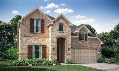 French country inspired facade with a garage | Image 1