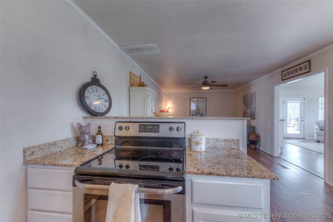 Stainless stove plus space to prep and serve. | Image 12