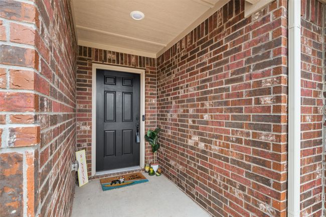 Fully bricked covered porch entryway | Image 4
