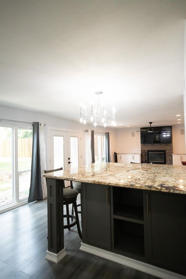 View from kitchen to breakfast bar and family room | Image 15