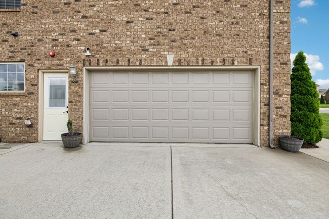 The home features a 2-car side-attached garage with a convenient man door for easy access. 1107 Sycamore Leaf Way Murfreesboro, TN 37129 | Image 40