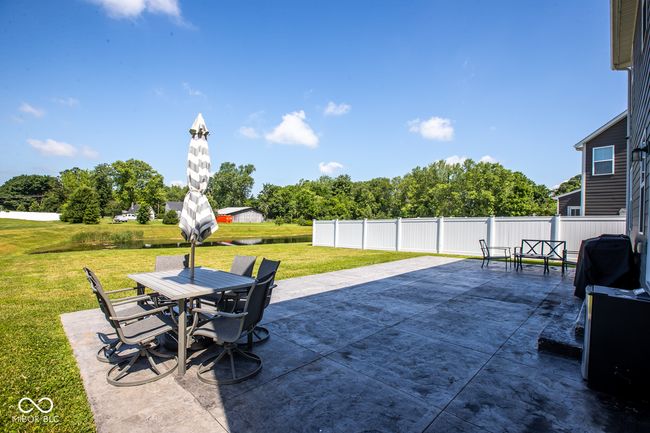 Relax and enjoy the view of the tranquil pond located behind the house | Image 31