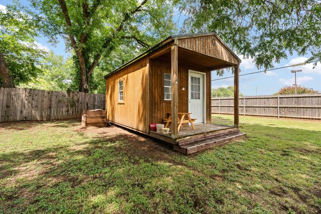 View of outbuilding featuring a fenced backyard | Image 27