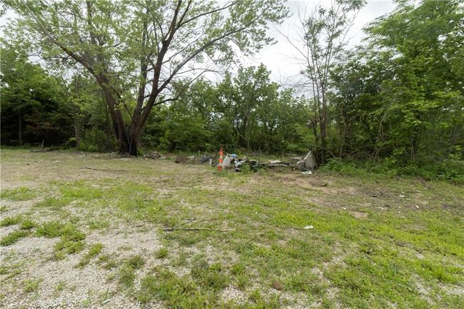 View of yard featuring a wooded view | Image 4