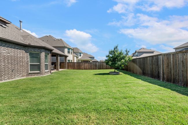 View of fenced backyard | Image 38