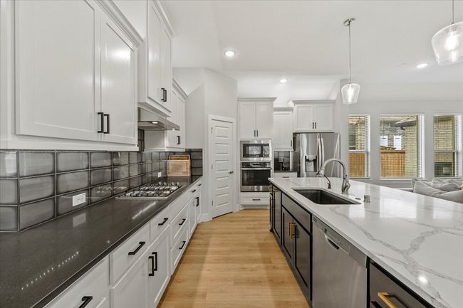 Designer style lighting and hardware & walk in pantry are only a few of this dream kitchen's many amenities | Image 16
