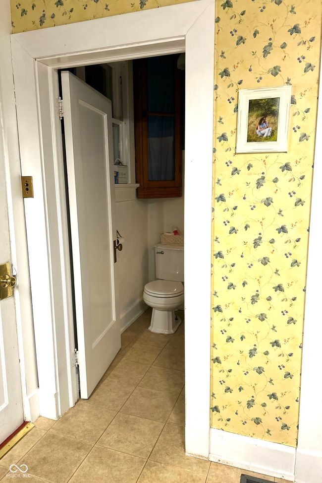 bathroom featuring toilet and tile patterned flooring | Image 21