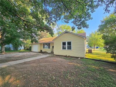 View of front with an attached garage | Image 1